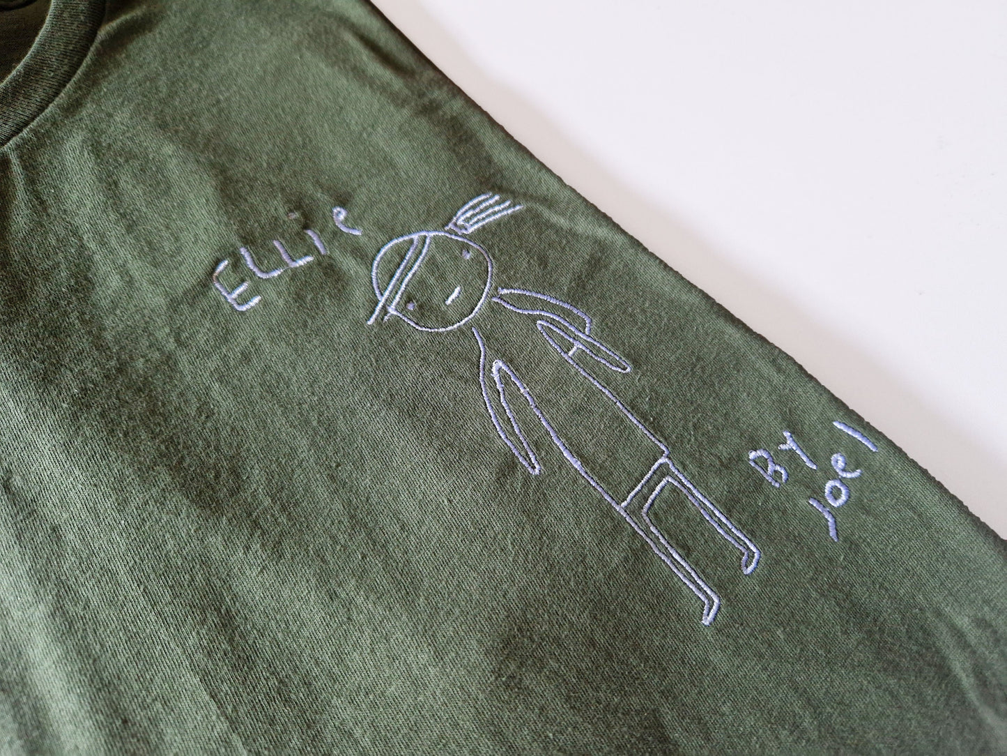 Ellie Drawing by Joel Embroidered T-Shirt